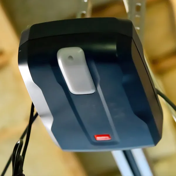New garage door opener motor installed on the ceiling