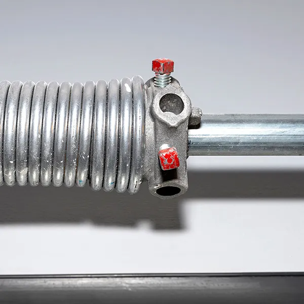 New torsion spring installed on a garage door